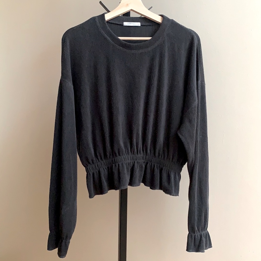Peplum crew neck sweater